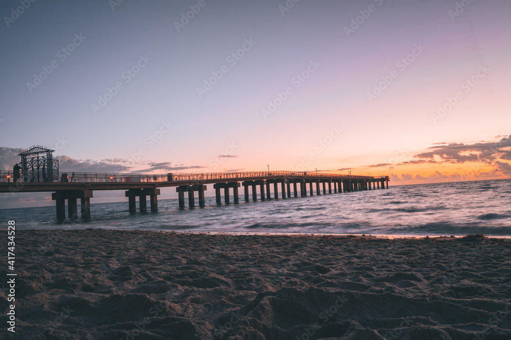 sunrise beach bridge pier water sky color orange travel florida 