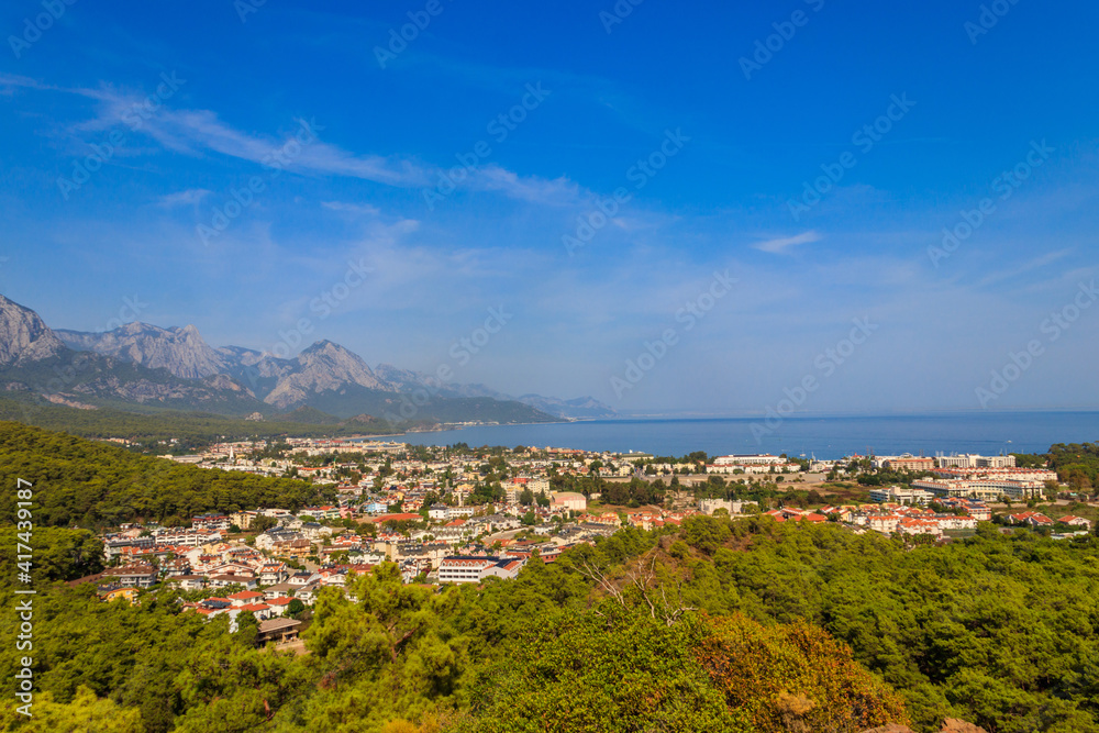 View of Kemer town on a coast of the Mediterranean sea in Antalya province, Turkey. Turkish Riviera. View from a mountain View of Kemer town on a coast of the Mediterranean sea in Antalya province, Turkey. Turkish Riviera. View from a mountain