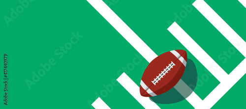 american football ball standing on white line.