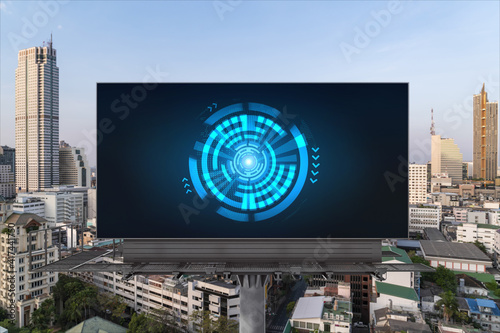 Technology hologram on billboard over panorama city view of Bangkok. The largest tech hub in Southeast Asia. The concept of developing coding and high-tech science.