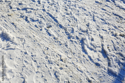 Snow with boot tracks and traces of the tread on it