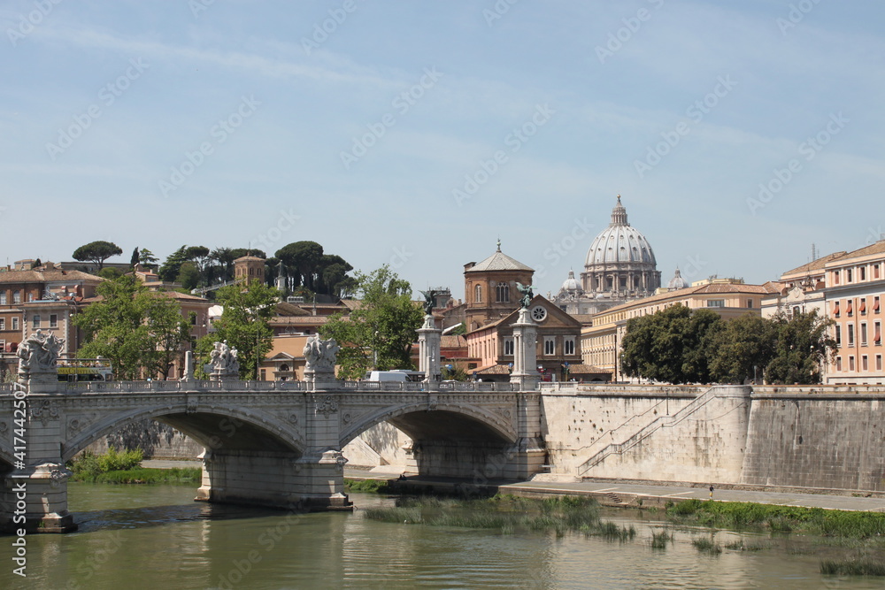 view of the Tiber river from the embankment on a sunny day, Italy
