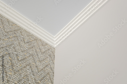 Detail of corner ceiling cornice with intricate crown molding. photo