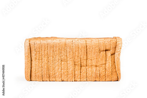 Obraz na plátně Pan de molde cortando en rebanadas sobre un fondo blanco liso y aislado