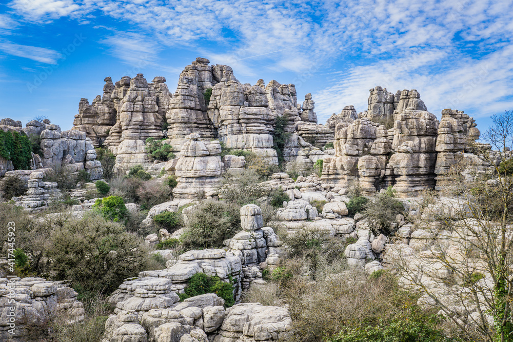 Hiking the Torcal de Antequerra National Park in Andalusia, Spain. This national is known for its unusual karst landforms, made of limestone Hiking the Torcal de Antequerra National Park in Andalusia, Spain. This national is known for its unusual karst landforms, made of limestone