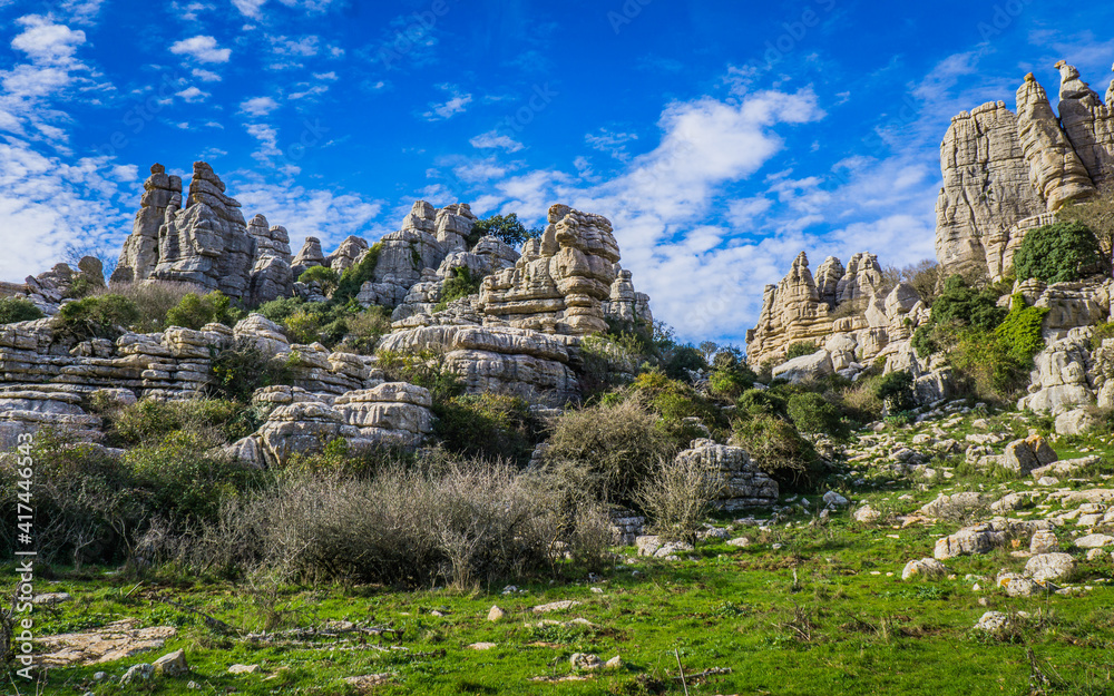 Hiking the Torcal de Antequerra National Park in Andalusia, Spain. This national is known for its unusual karst landforms, made of limestone Hiking the Torcal de Antequerra National Park in Andalusia, Spain. This national is known for its unusual karst landforms, made of limestone
