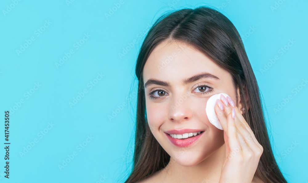 Beautiful brunette woman with clean perfect fresh skin using cotton pad skin care concept. Concept of beauty, health treatment. Cosmetology and spa. Using makeup sponge. Portrait woman using sponge Beautiful brunette woman with clean perfect fresh skin using cotton pad skin care concept. Concept of beauty, health treatment. Cosmetology and spa. Using makeup sponge. Portrait woman using sponge