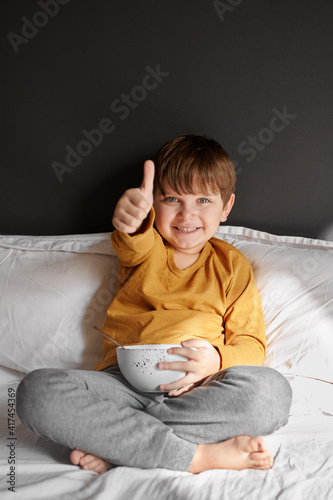 child shows class at breakfast. boy breakfast