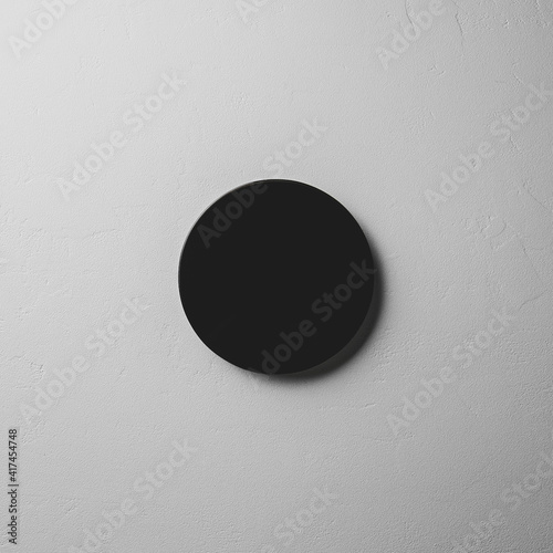 Black obsidian mirror on gray stone surface photo