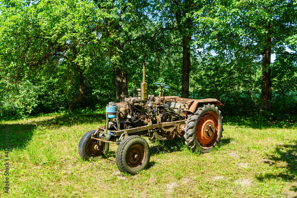 old broken tractor in the field