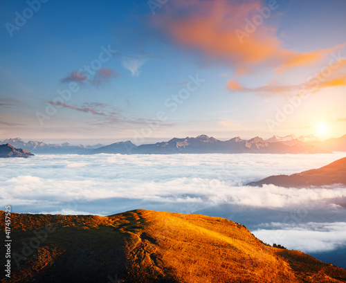 Morning view of the alpine valley in fog. Location place Seceda peak, Dolomite alps, Italy, Europe.