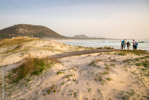 Wooden walkway giving access to the wild beach of Lariño in Carnota, Galicia, Spain. photo