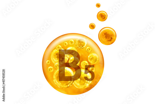  Vitamin B5 capsule. Golden balls with bubbles isolated on white background. Healthy lifestyle concept. photo