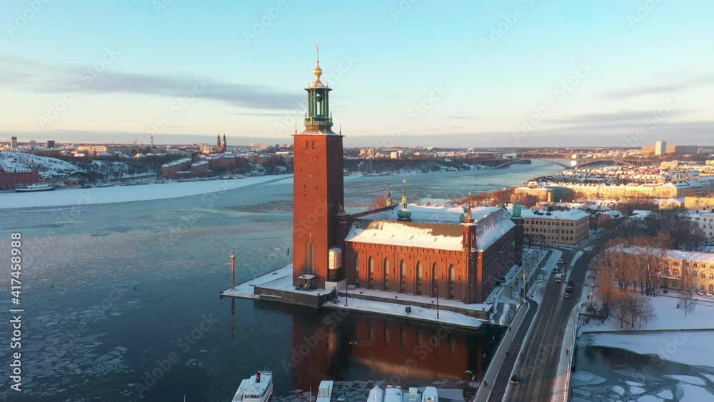 Stockholm City Hall covered in snow, aerial drone footage. Beautiful winter's day. Stockholm City Hall covered in snow, aerial drone footage. Beautiful winter's day.