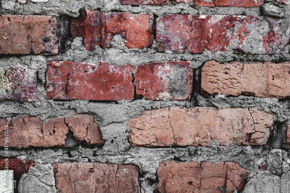 Obraz premium Background old surface, vintage cracked wall, red handmade brick close-up, grungy texture.