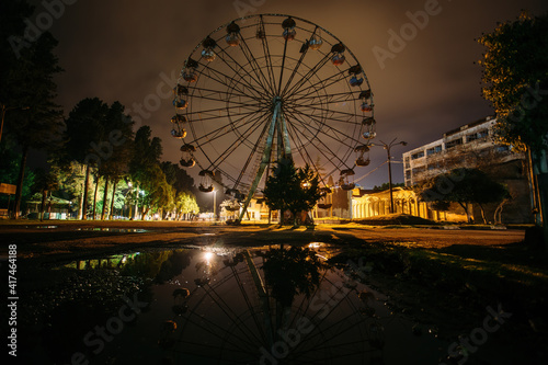 Old rusty broken abandoned Ferris wheel at night © Mulderphoto