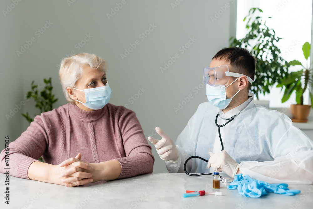 Portrait of elderly caucasian woman wearing protective medical mask. Care for the elderly people during corona virus outbreak, a helping hand, home care concept