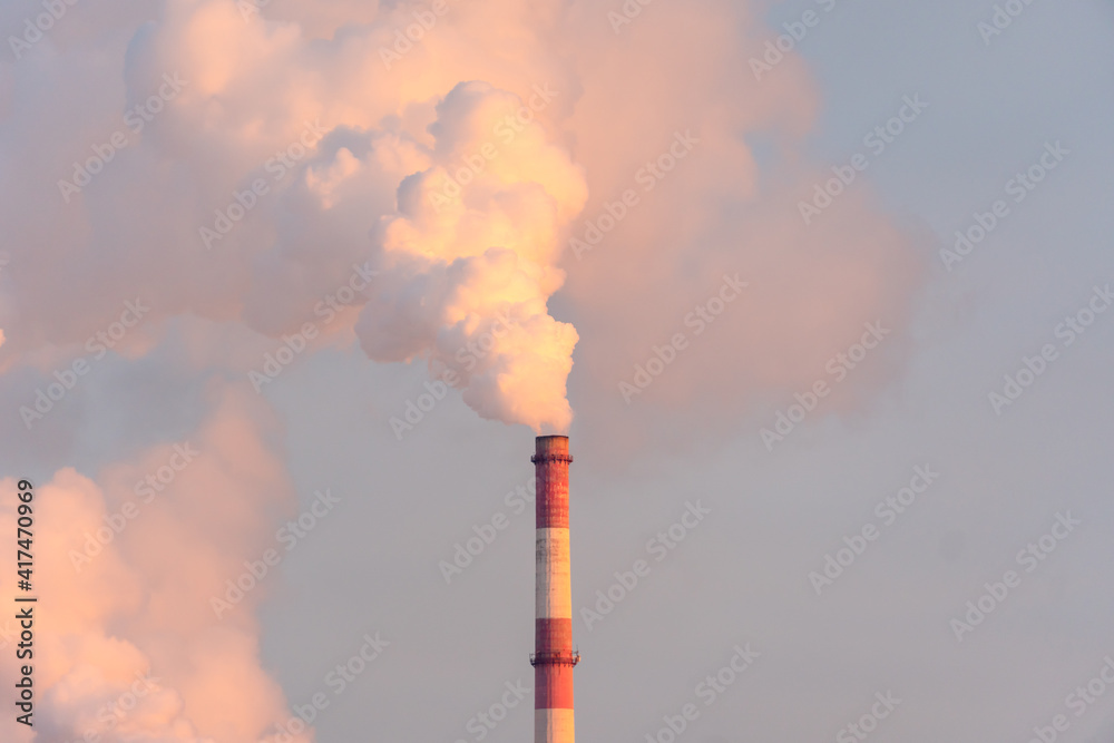Plant pipes pollute atmosphere. Industrial factory air pollution, smokestack exhaust gases. Industry zone, thick smoke plumes. Climate change, ecology and global warming