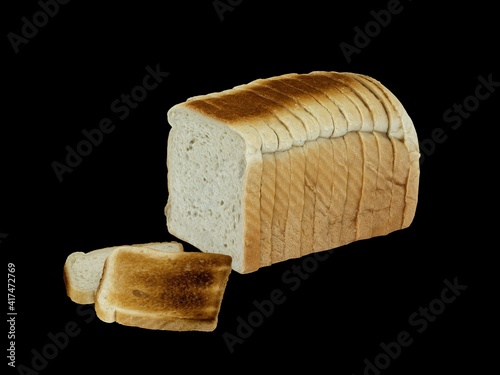 sliced bread for toast on black background
