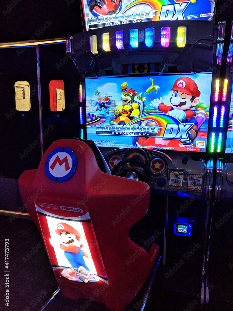 Mario Kart Arcade GP DX Cabinet unit on for play at Lucky Strike Stock  Photo | Adobe Stock