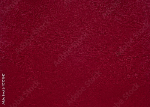 Close up leather texture crimson in color, background.