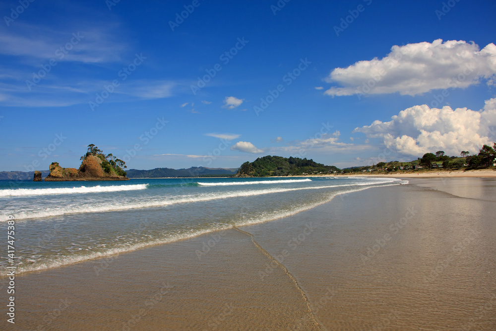 Idyllic sand beach on Coromandel peninsula in New Zealand