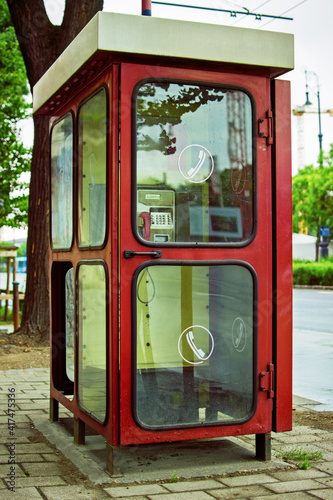 Old telephone booth in Budapest, Hungary. An old public phone in Budapest. Types of communication of the past. 