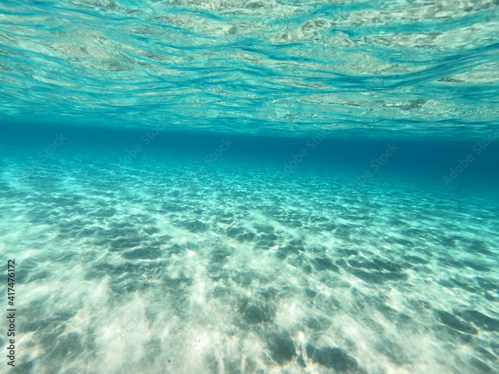 Underwater sandy sea bed in tropical exotic turquoise bay