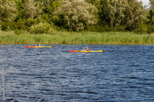 Kayaking on the river in clear weather © Minakryn Ruslan 