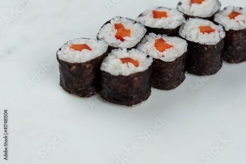 Wallpaper Mural Sushi rolls prepared by professional asian chef with traditional Japanese ingredients. Salmon, rice, vegetables, sesame seeds.  Torontodigital.ca