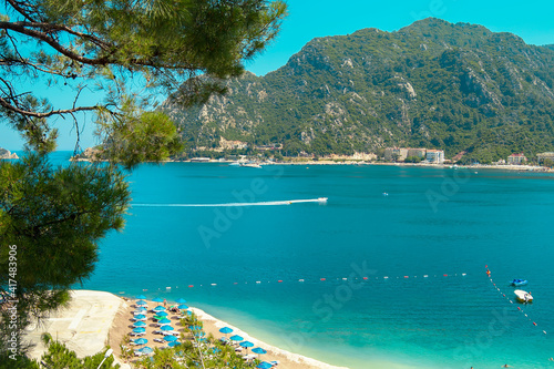 Mediterranean coast, beaches of the city of Marmaris. Turkey. Sunny bright day on the beach. Rest and travel to the sea.