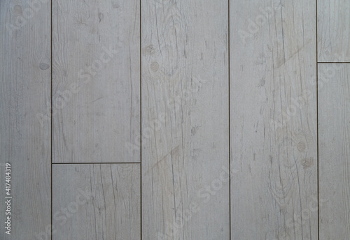 Gray grunge wooden surface, texture with natural patterns and seams. Flooring. Old natural wood parquet plank texture can be use as background banner. horizontal close-up, texture for interior design