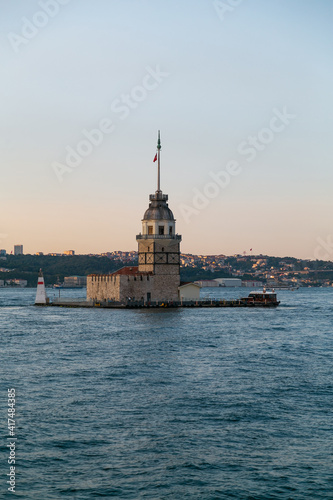 Maiden Tower, Kiz Kulesi on the Asian side of Istanbul at sunset in the middle of Bosphorus, Turkey. One of the symbols of Istanbul. Ancient lighthouse of the Ottoman period. Girl tower. Vertical phot