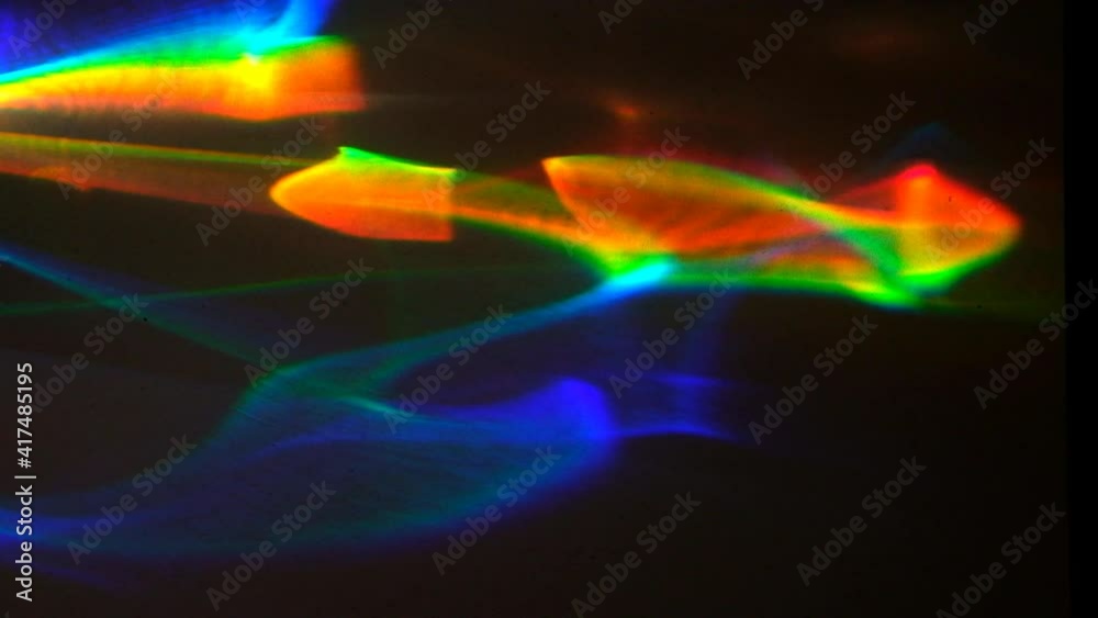 Refracted light in the form of caustics in the colors of the rainbow ...