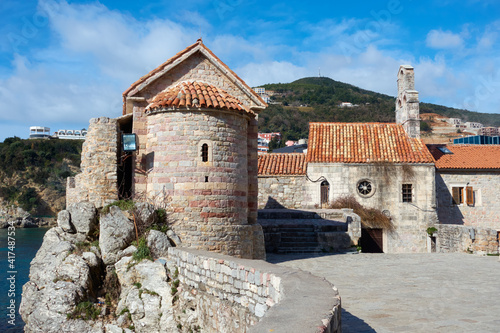 Saint Sava church and church of Santa Maria in Punta in Old Town of Budva, Montenegro photo