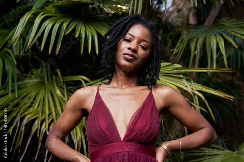 Portrait of African American woman with plants