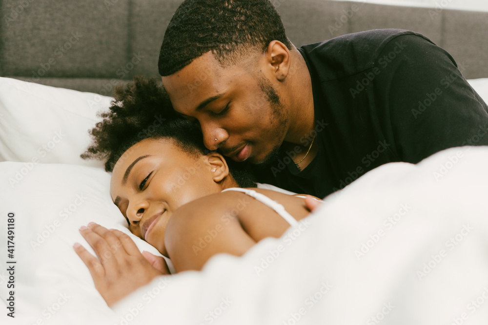 Boyfriend waking up girlfriend from sleep, weekend morning Boyfriend waking up girlfriend from sleep, weekend morning