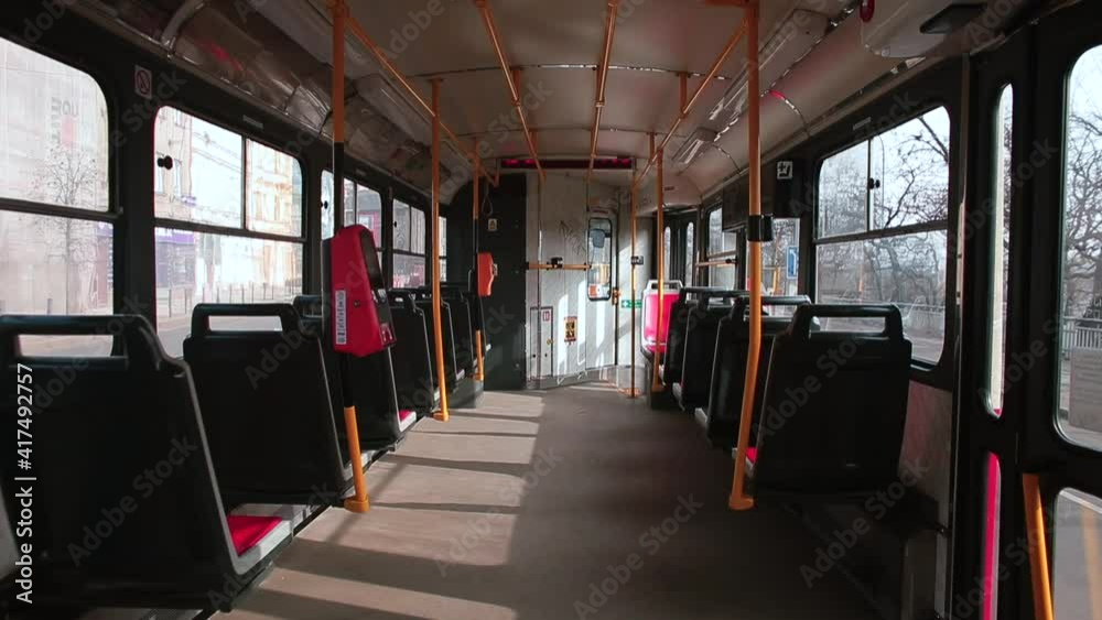 The movement of the camera in the passenger compartment of the tram in Prague. An empty cabin, a ban on the transport of passengers in the COVID-19 lockdown. The movement of the camera in the passenger compartment of the tram in Prague. An empty cabin, a ban on the transport of passengers in the COVID-19 lockdown.
