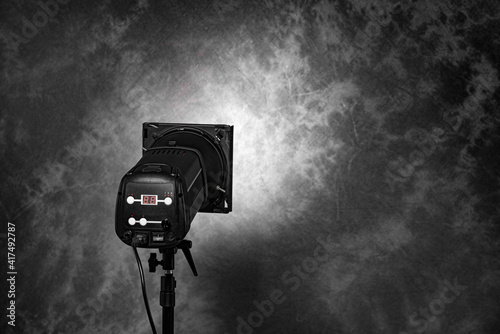 Studio professional flash on a dark background.