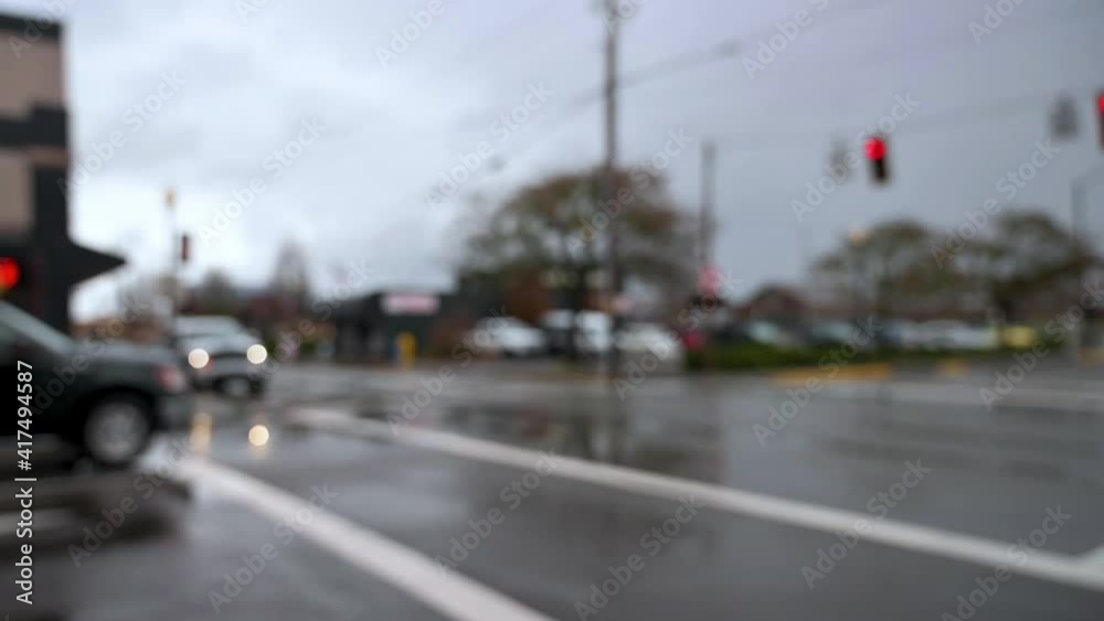 Slight pan left shot cars crossing intersection. Intentional blur, slomo