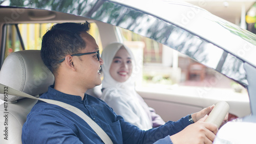 Muslim family in the car will go home to celebrate Eid