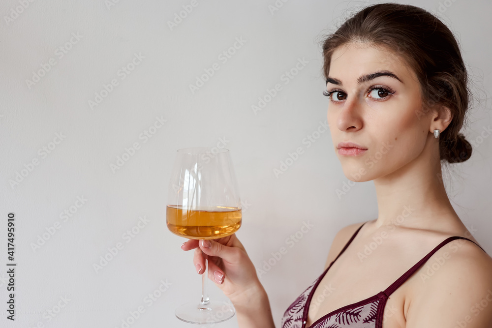 woman enjoying glass of white wine woman enjoying glass of white wine