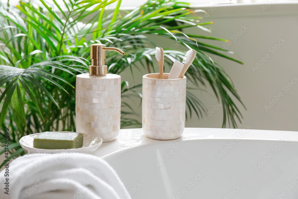 Obraz premium Soap with toothbrushes in interior of bathroom