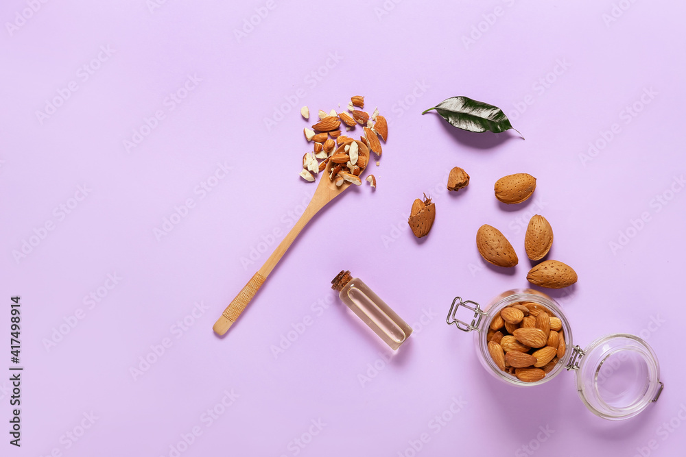 Composition with almond oil on color background Composition with almond oil on color background