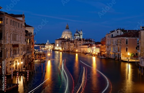 Boat lights trecks on water. Grand canal from Academia bridge in Venice at twilight. Italy. 