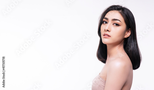 Beauty, cosmetics, healthy, treatment, skincare and spa concept. Asian young woman looking at camera with clear fresh skin. Teenager with perfect treatment skin over isolated white background.