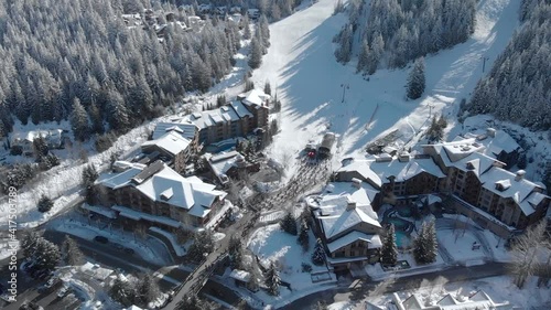 Large ski lift line up of skiiers due to Covid 19 restrictions at Whistler Mountain, BC. 4K 24FPS. photo