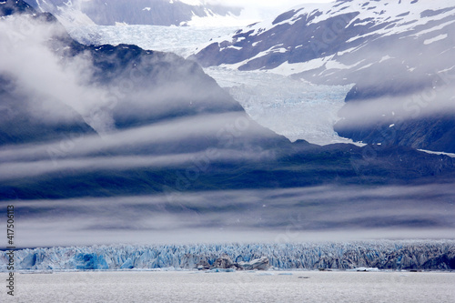 USA, Alaska, Alsek Lake. Clouds over mountain and glacier. photo