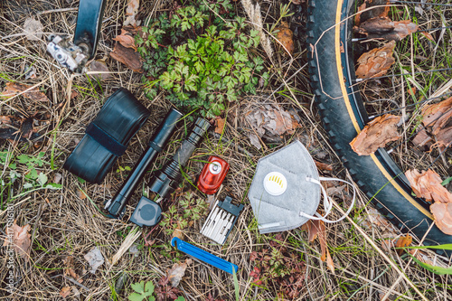 Wallpaper Mural Bike tyre tube puncture repair tool kit. Items replacements and tools for a safe cycling. face mask, with filter pm 2.5. Flu epidemic, dust allergy, protection against virus. Covid 19 virus concept Torontodigital.ca