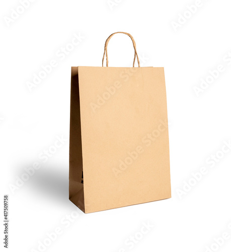 Brown paper bag isolated on white photo